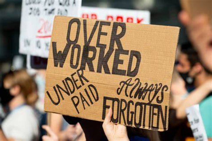What is it called when workers withhold their labor?